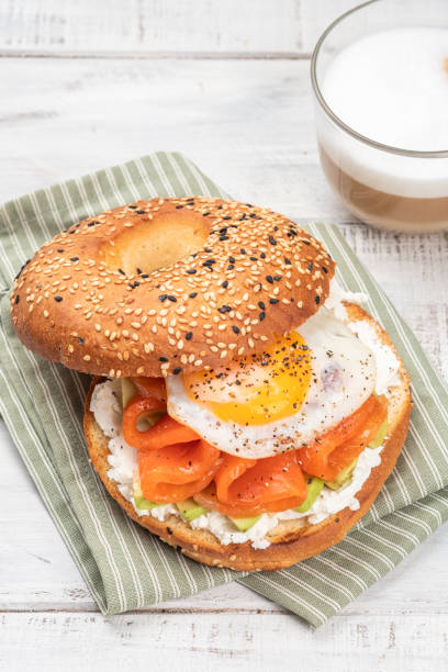 istock Bagel sandwich with salmon, cream cheese, avocado and egg. 1387141701