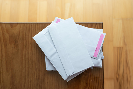 Envelopes stacked with household bills
