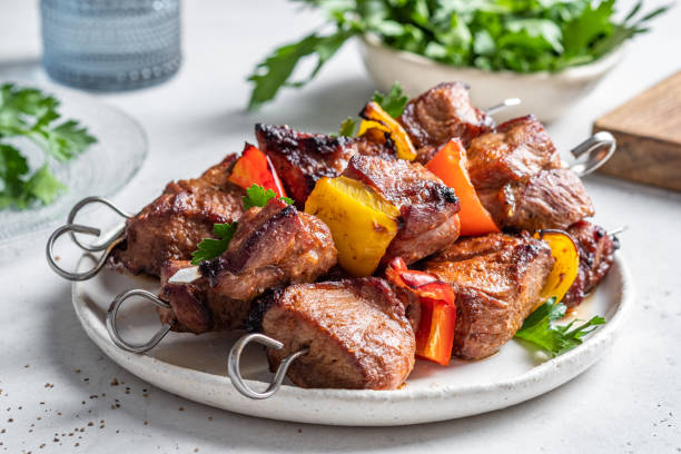 istock Grilled pork kebab with red and yellow pepper 1387141802