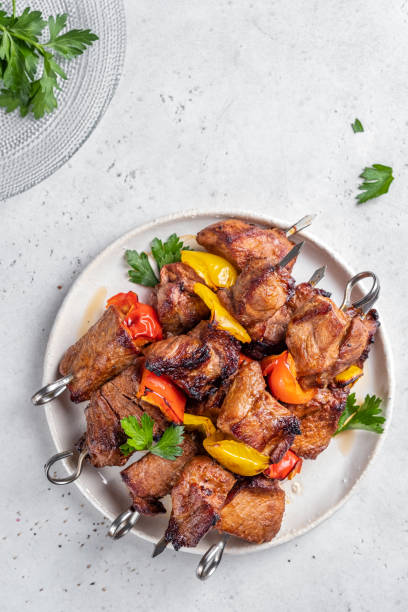istock Grilled pork kebab with red and yellow pepper 1387141823