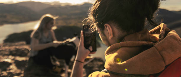 istock Young people on mountain hike at sunset 1387141861