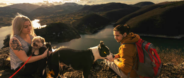 istock Young people on mountain hike at sunset 1387141877