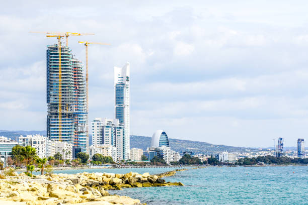 view of the Limassol promenade with several skyscrapers under construction view of the Limassol promenade with several tower cranes and skyscrapers under construction limassol marina stock pictures, royalty-free photos & images
