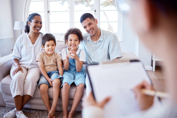 Shot of a family meeting with a therapist Their weekly sessions have been so beneficial foster care stock pictures, royalty-free photos & images