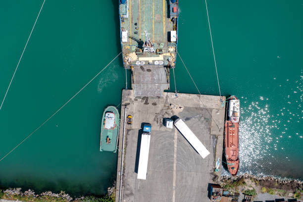 istock Aerial view of Ro-Ro ship loading trucks. 1387144747