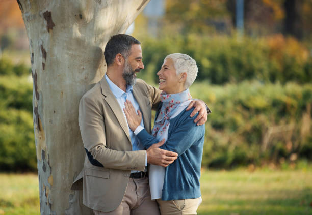 istock Mature couple walking through a forest. 1387146139