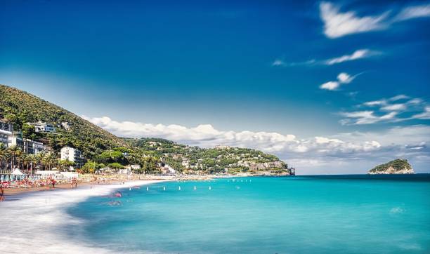 the bay of spotorno with its beaches of fine sand and the crystal clear sea the bay of spotorno with its beaches of fine sand and the crystal clear sea in August, in western Liguria province of savona stock pictures, royalty-free photos & images