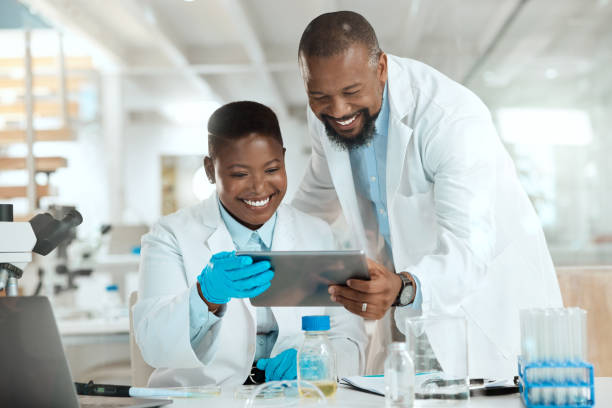 istock Shot of two scientists using a digital tablet in a laboratory 1387148715