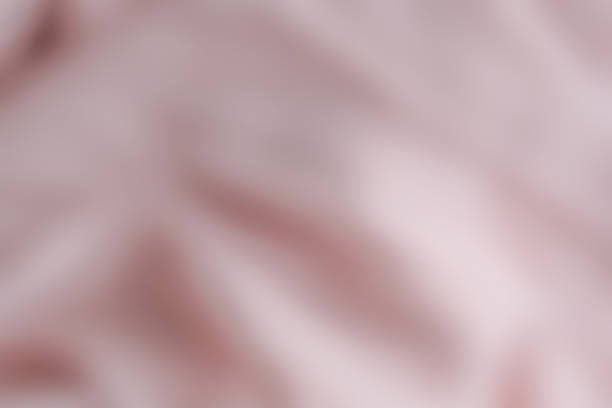 istock Pink folded blurred abstract background suitable for tender delicate intimate female design and themes 1387149531