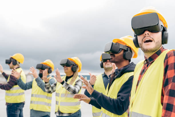 istock Multiracial team of industrial workers using virtual reality headsets at shipping cargo port - Metaverse and freight logistic concept - Focus on right man face 1387149677