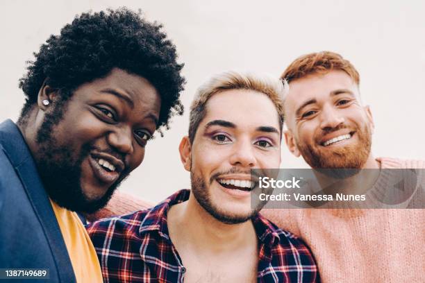 Diverse Friends Having Fun Together Doing Selfie Outdoor Focus On Gay Male Face Wearing Makeup Stock Photo - Download Image Now