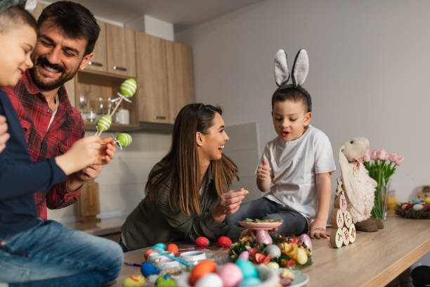istock Happy family celebrating Easter smiling having fun 1387150030