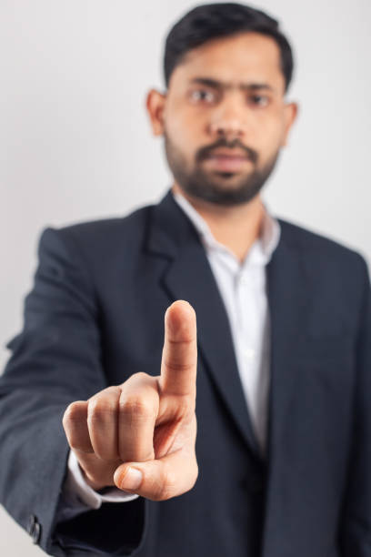 istock business man finger touching on blank space 1387153478