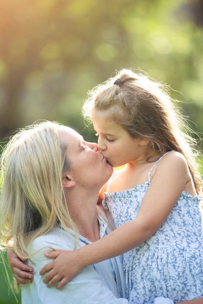 istock Mother and daughter in the park. 1387154022