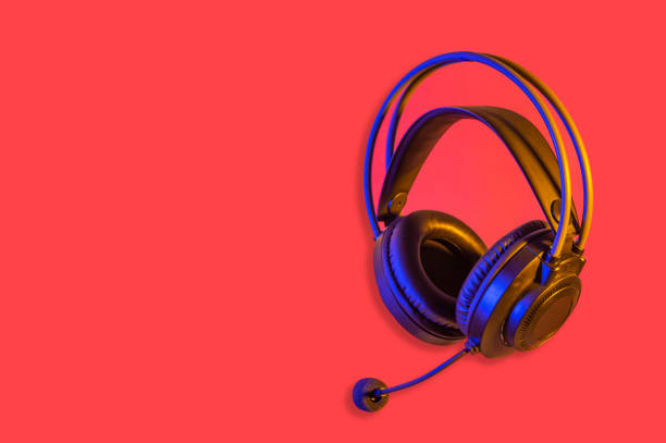 istock Black headphone on red banner showing customer service concept 1387154271