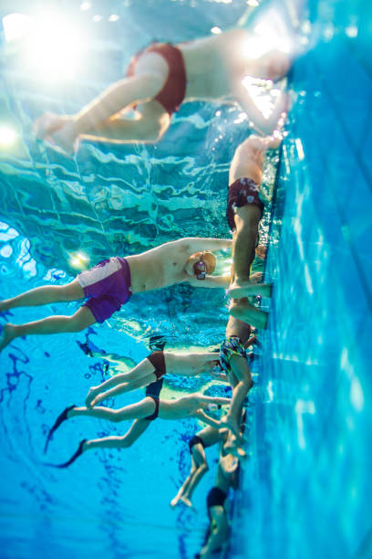 istock Children on training in swimming pool 1387155558