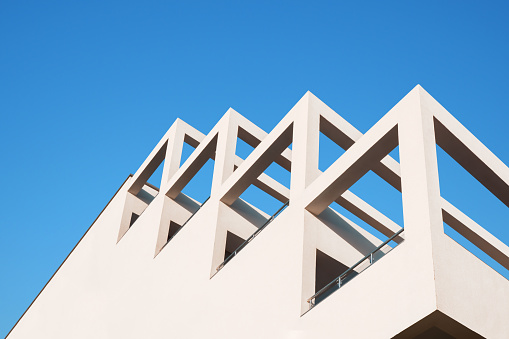 Modern architecture minimal building abstract concrete house. Abstract architecture geometric building modern pillar arch balcony construction. Geometry architecture design building balcony background
