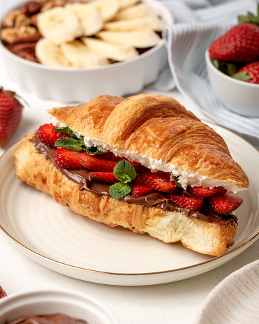 Fresh french breakfast croissant with strawberry