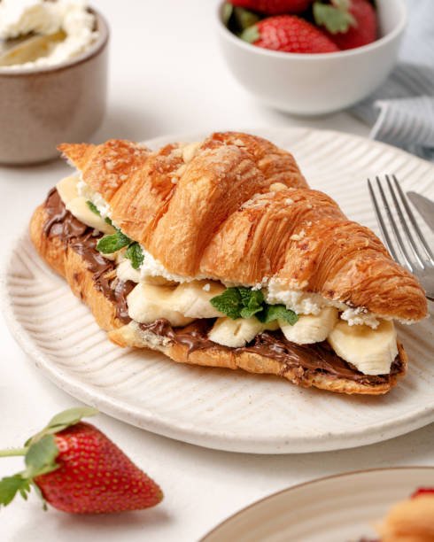 istock Close up croissant with bananas, chocolate and cream. 1387158620