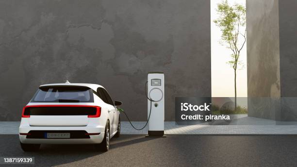 Electric Vehicle Charging Stock Photo - Download Image Now - Electric Car, Electric Vehicle, Electric Vehicle Charging Station
