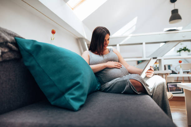 istock pregnant woman at home 1387163711