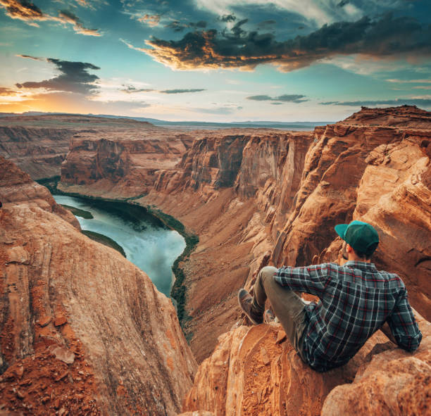 istock man on top of horse shoe bend 1387164530