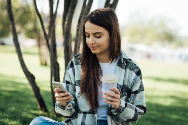 istock Girl texting message on phone 1387172250