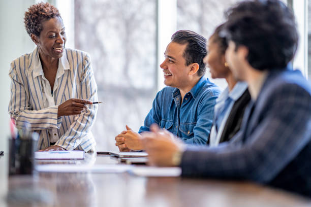 istock Woman Leading A Business Meeting 1387177002