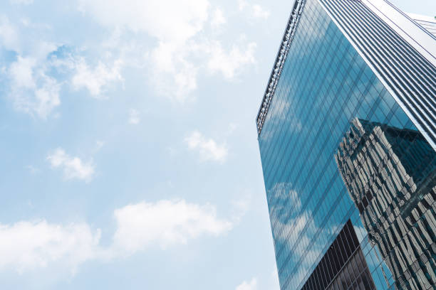 istock perspective background abstract building central business district construction with blue sky reflection mirror of the tall building 1387182792
