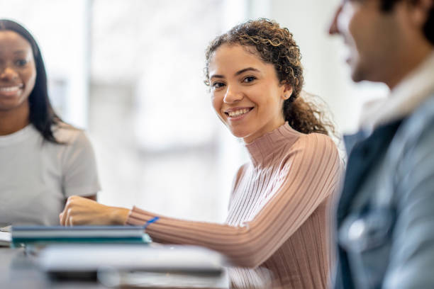 istock Female University Student Studying with Peers 1387183629