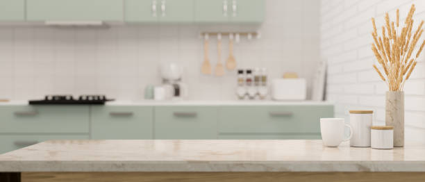 istock Marble kitchen countertop with coffee cup, sugar and coffee jar, minimal vase and copy space 1387187768