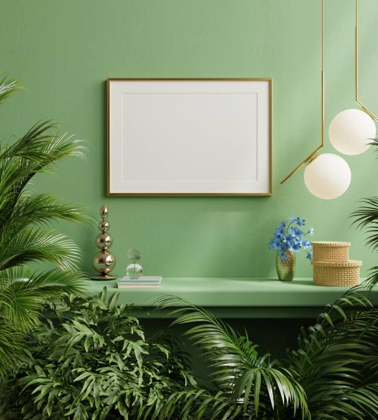 istock Mock up poster frame on the green shelf with beautiful plants. 1387189517