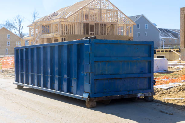 Construction trash dumpsters on metal container, house renovation.