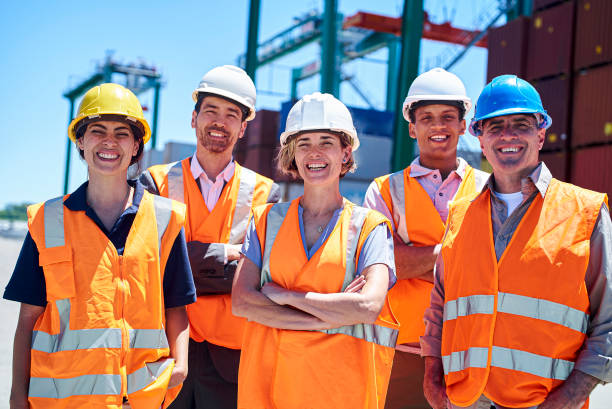 istock Cargo handlers and managers standing at container terminal 1387191919