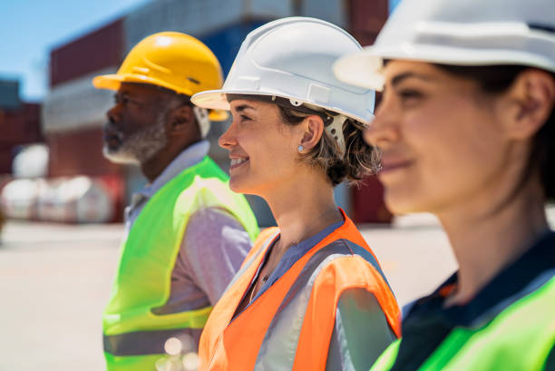 istock Dock coworkers standing next to each others at shipping yard 1387192010