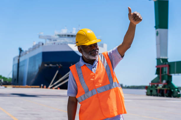 istock African american dock worker standing with thumbs up 1387193152