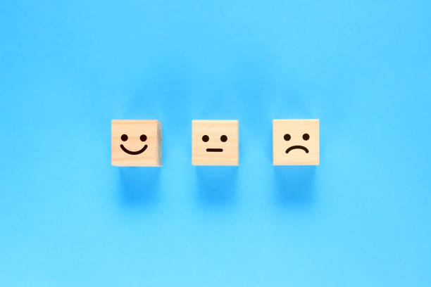 istock Building blocks with three levels of expressions painted on them. 1387201840