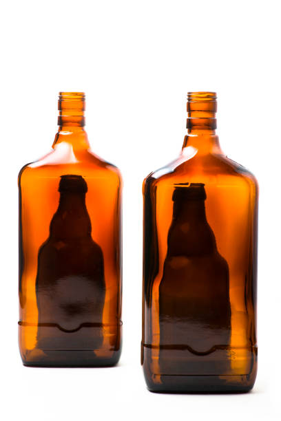 Still life with brown bottles on a white background