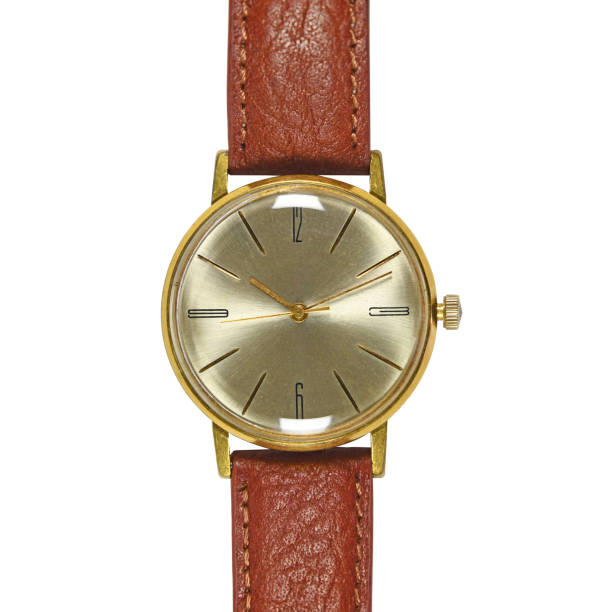 istock Golden wrist watch with brown leather strap isolated on white background 1387211820