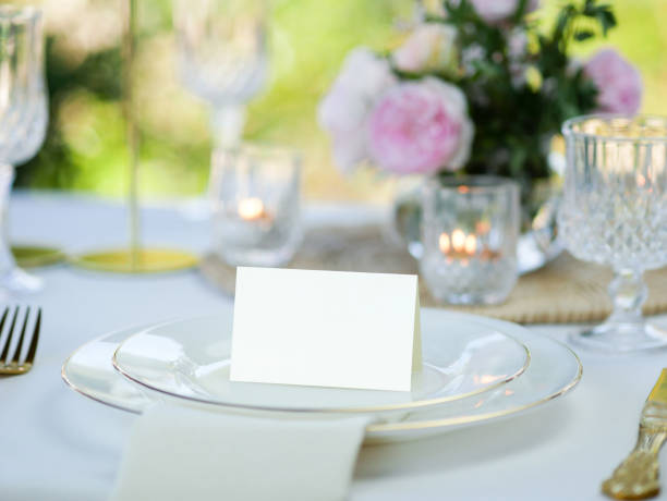 istock Mockup white blank space card, for Name place, greeting, invitation on wedding table setting background. with clipping path 1387213993