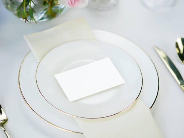 istock Mockup white blank space card, for Name place, greeting, invitation on wedding table setting background. with clipping path 1387213997