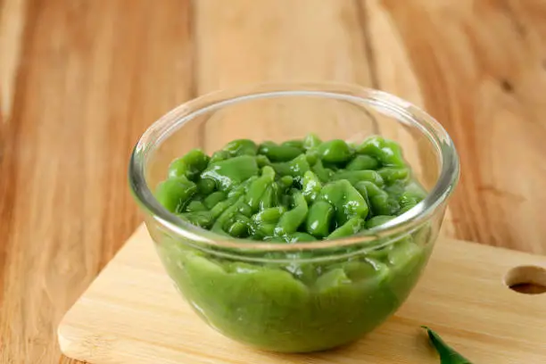 Photo of Cendol Elizabeth Bandung in A Clear Bowl, on Wooden Table.