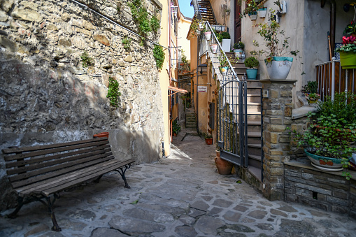 Castellabate, Italy, 03/12/2022. A characteristic alley between the walls of old houses in a medieval village in the province of Salerno.