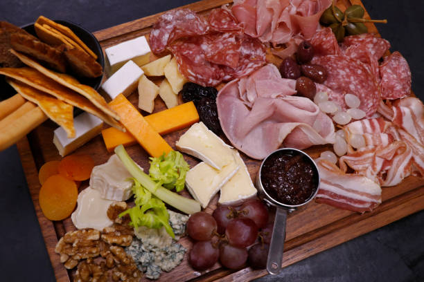 istock assorted matured cheese and cold meat cut platter with condiment 1387218518