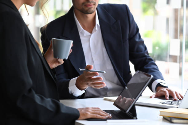 istock Start up business people discussing project statistics or financial report together. 1387218539