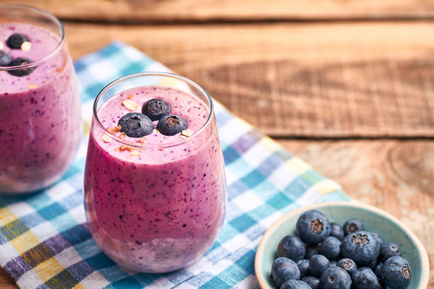 istock Blueberry smoothie in glass. 1387220802