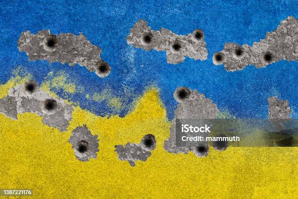 Ukrainian Colors On Damaged Wall Stock Photo - Download Image Now - 2022 Russian Invasion of Ukraine, War, Ukraine