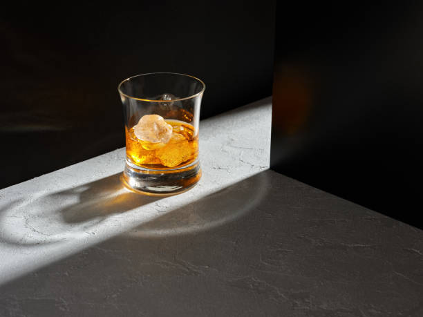 glass of elegant whiskey with ice. - hard liqueur imagens e fotografias de stock