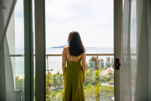istock The young woman stood on the balcony 1387223698