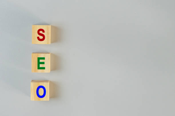 istock wooden cubes for SEO Search engine optimization  on gray background.Copy space. 1387224345